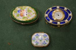Miniature porcelain boxes, one fitted with a clock.