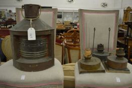 A copper ship's lantern, labelled Babord together with three ship's lanterns spare lamps.