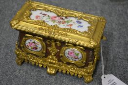 A small ormolu casket mounted with porcelain panels (AF).