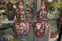 A pair of Imari jars and covers.