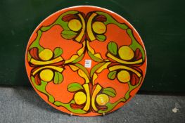 A good large Poole Pottery Delphis charger, orange ground with stylized decoration, shape no. 54,