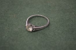A decorative single stone ring.