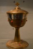 A silver gilt chalice and cover.