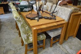 Two sets of four oak framed high-back dining chairs.