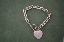 A silver bracelet.