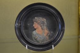 A moulded wax portrait miniature.