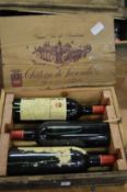 A cased set of three bottles of Chateau Parenchere 1982.