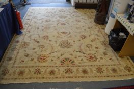An Indian carpet, beige ground with stylized floral decoration 10ft 2ins x 8ft.