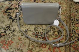 A Ralph Lauren grey patent leather handbag.
