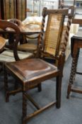 A set of four oak dining chairs.