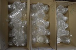 A large quantity of glass lampshades.