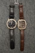 Two large wristwatches.