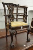 A miniature Chippendale style carved mahogany armchair.