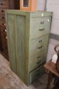 An old four drawer filing cabinet, later painted.
