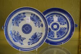 Two blue and white warming dishes.