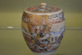 A Satsuma barrel shaped jar and cover.