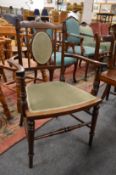 An Edwardian inlaid mahogany small armchair.
