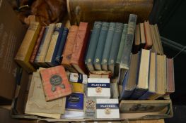 A box of books, cigarette cards.