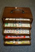 A Chinese Mahjong set in a carved hardwood box.