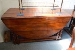 A good large hardwood oval drop-leaf double gate-leg dining table.