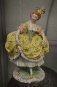 A Capodimonte style porcelain figurine of a lady.