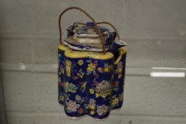A Chinese teapot, blue glazed with floral decoration.