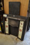 An Art Nouveau cast iron fire place with porcelain panels together with a later marble hearth.