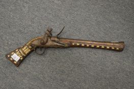 An old eastern flintlock pistol.