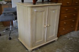 A painted pine two door cupboard.