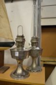 Two oil lamps.