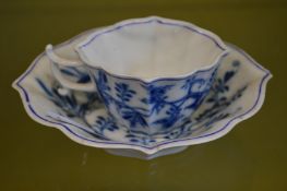 A Meissen blue and white small cup and saucer.