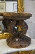 A Papua New Guinea carved wood and polychrome decorated stool.