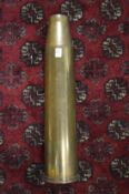 A large brass shell case, 23ins high.