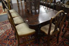 A good Regency mahogany extending dining table with patent ratchet mechanism and two extra leaves.