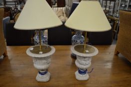 A pair of decorative urn shaped table lamps.