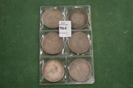 Six Chinese silver coins.