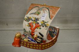 A Satsuma model of a sailing boat.