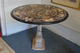 An Italian Renaissance revival inlaid marble circular table on a carved dolphin form support (AF).