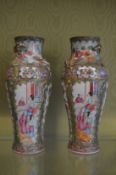 A pair of Canton vases with moulded decoration.