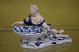 A Meissen blue and white porcelain figural dish.