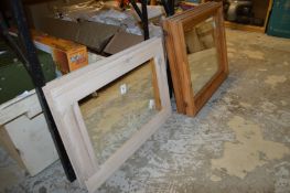 Two pairs of pine framed mirrors.