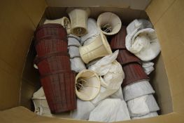 A quantity of small lampshades.