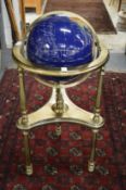 A floor standing globe made from numerous specimen stones.