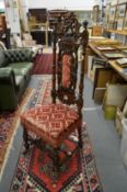 A continental carved walnut high back hall chair.