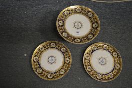 A Coalport decorative porcelain tazza and pair of matching plates with Army Medical Corps emblem.