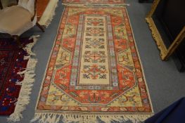 A Persian style beige ground rug.