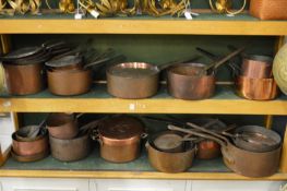A good large collection of 19th century copper cooking pans and similar vessels.