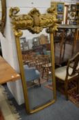 An unusual carved and gilded dressing mirror.