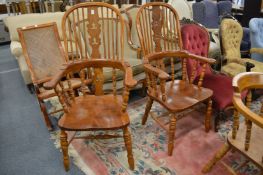 A pair of Victorian style ash, beech and elm broad arm high-back Windsor armchairs.