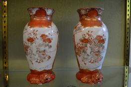 A pair of Kutani vases with unusual lion moulded bases.